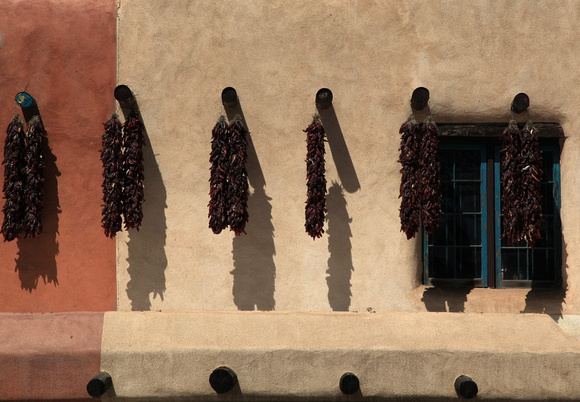 adobe wall and ristras in Plaza